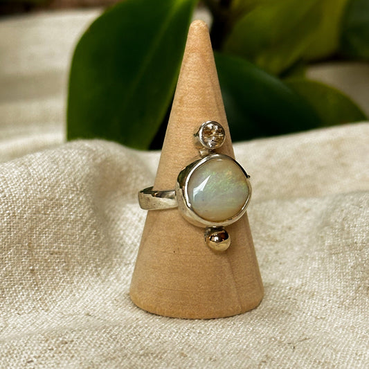 Pipe Opal golden rutile quartz ring close up, gold thread inclusions Natural Earth Collective Ohio