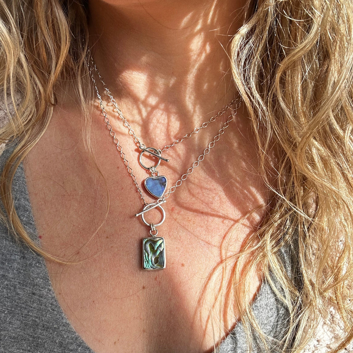 Abalone toggle necklace on neck, handcrafted ocean-inspired Natural Earth Collective Ohio