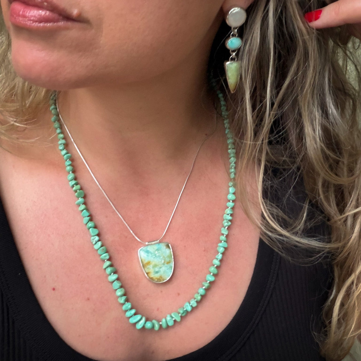 Opalized wood in shades of moss, yellow and aqua pendant set in sterling silver on a sterling silver snake chain. Natural earth collective Ohio