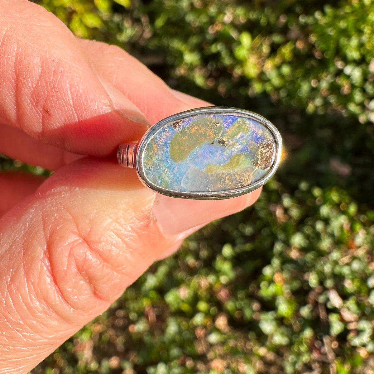 Purple Boulder Opal ring on hand, rare violet opal color Natural Earth Collective Ohio
