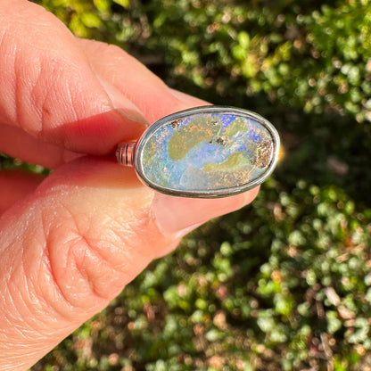 Purple Boulder Opal ring on hand, rare violet opal color Natural Earth Collective Ohio