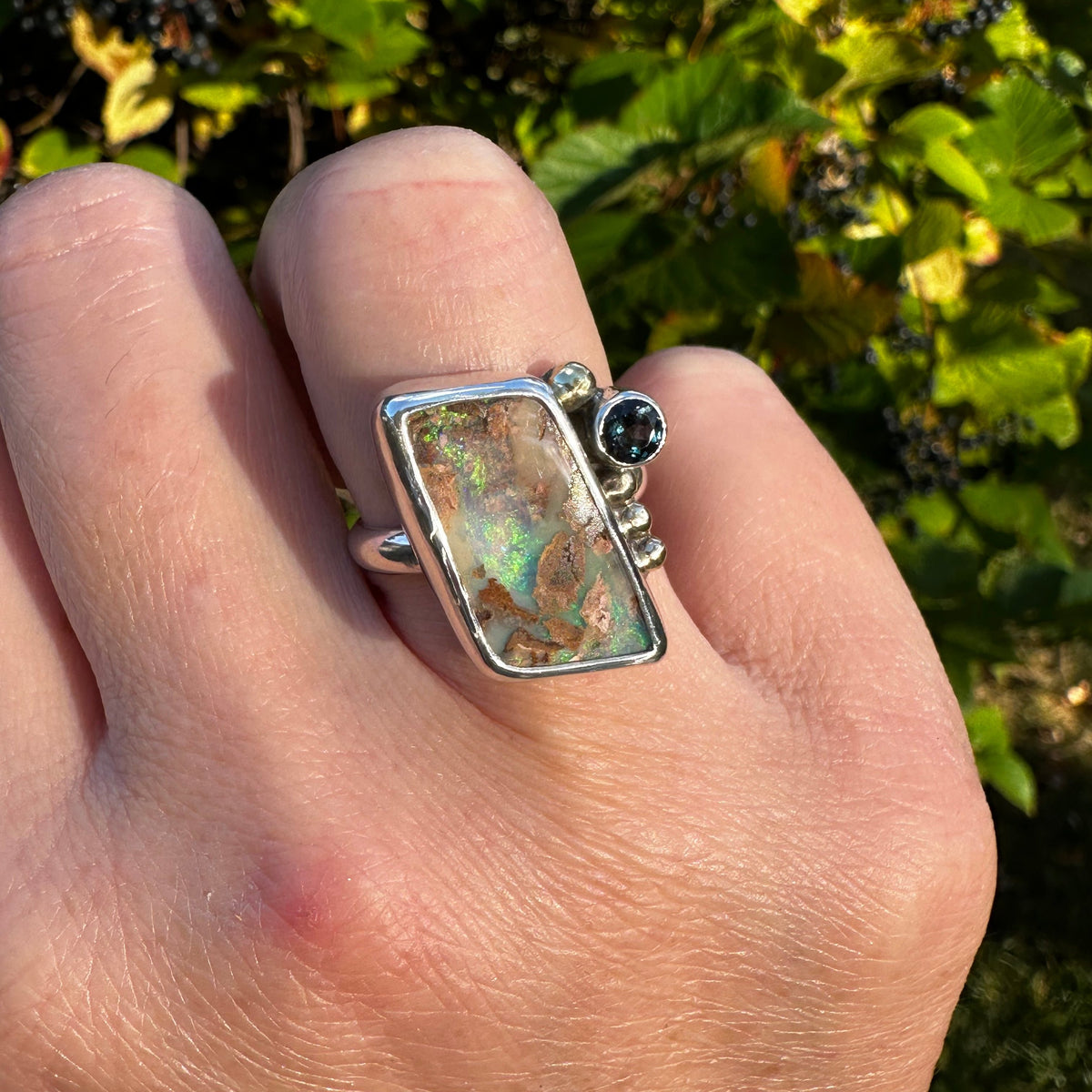 Deep blue Boulder Opal London Blue Topaz ring close up, sea green teal color Natural Earth Collective Ohio