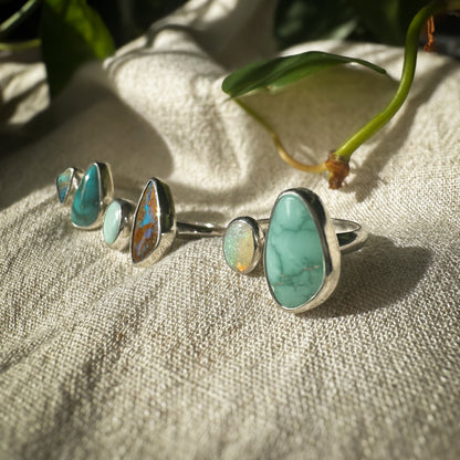 Turquoise and opal open shank ring on hand, one of a kind handcrafted Natural Earth Collective Ohio