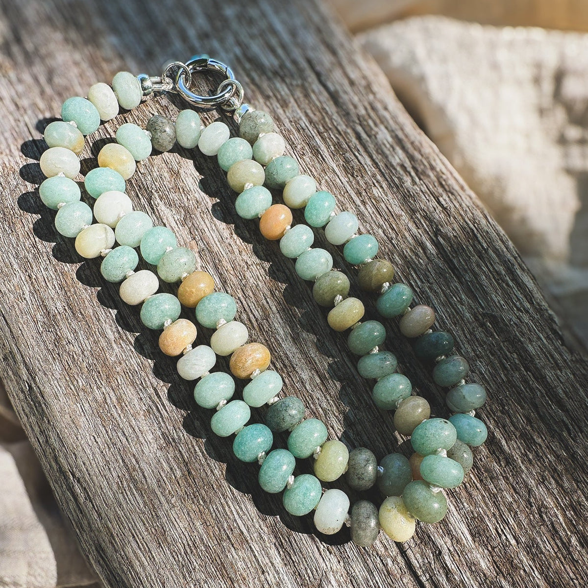 Multi shade Amazonite Beaded Necklace, hand knotted on cream silk thread with a circle push clasp that can be worn in back or front to accommodate a pendant. Natural Earth Collective, Ohio