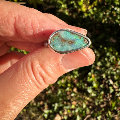 Blue Boulder Opal ring on hand, one of a kind handcrafted Natural Earth Collective Ohio