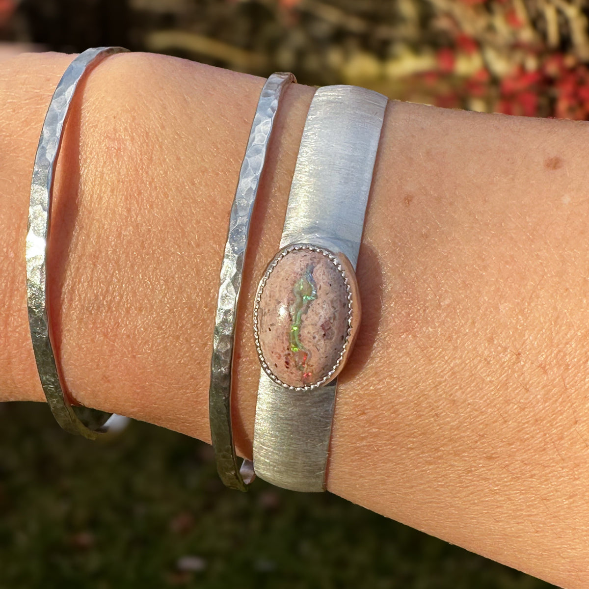 Cantera Opal cuff bracelet on wrist, one of a kind handcrafted Natural Earth Collective Ohio