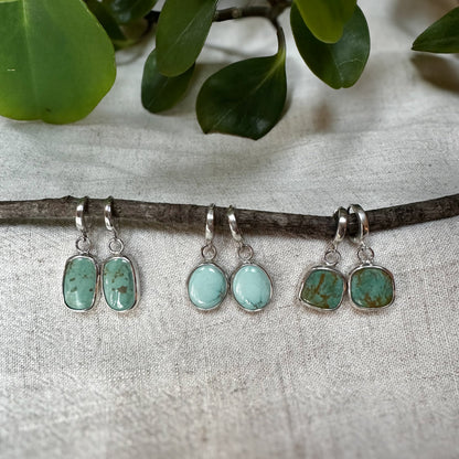 Lone Mountain Turquoise hinge hoop earrings on ear, one of a kind Natural Earth Collective Ohio