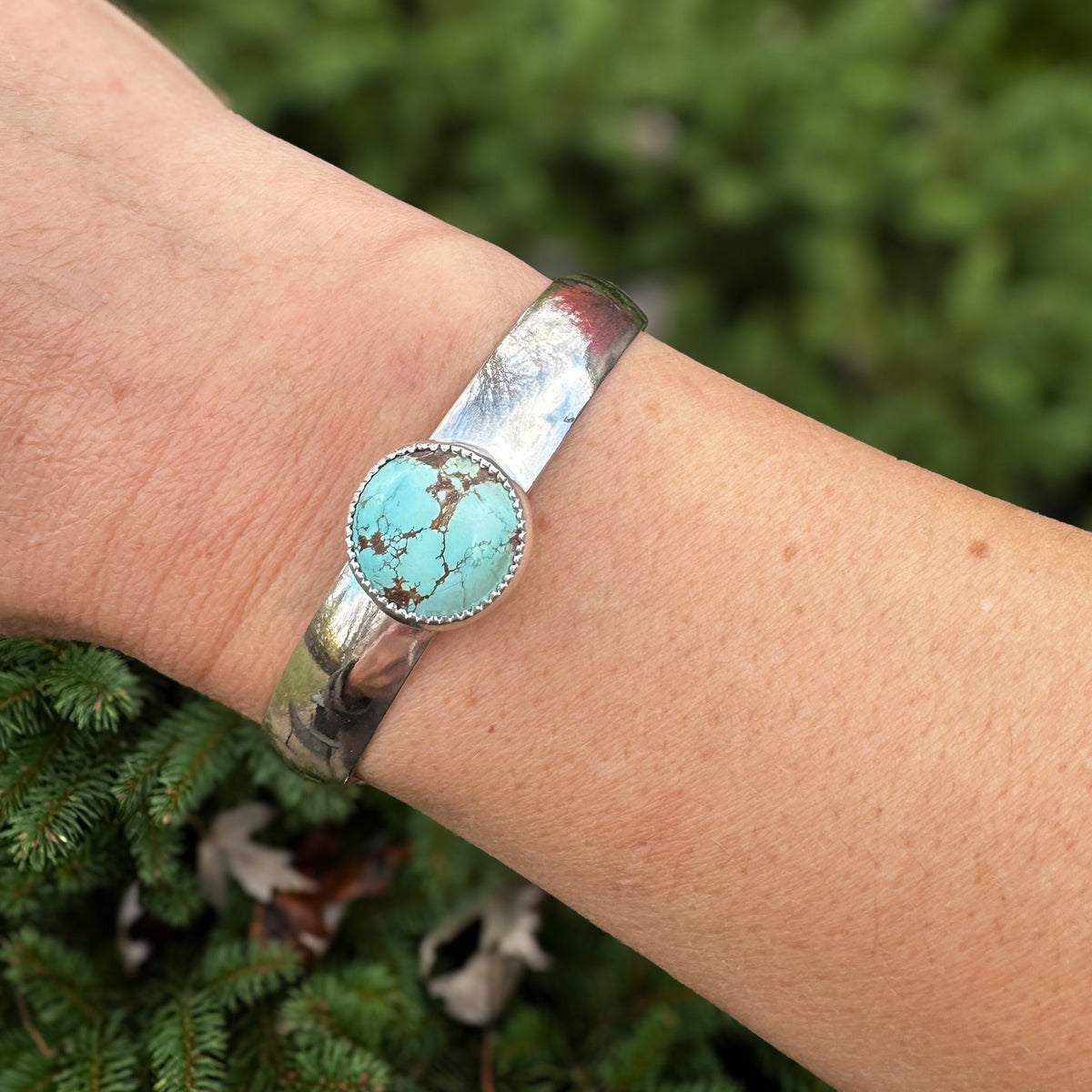Turquoise cuff bracelet on wrist, one of a kind handcrafted Natural Earth Collective Ohio