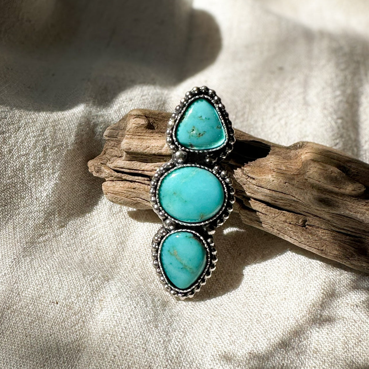 Cloud Chaser Turquoise Tidepool ring close up, three deep blue turquoise stones Natural Earth Collective Ohio