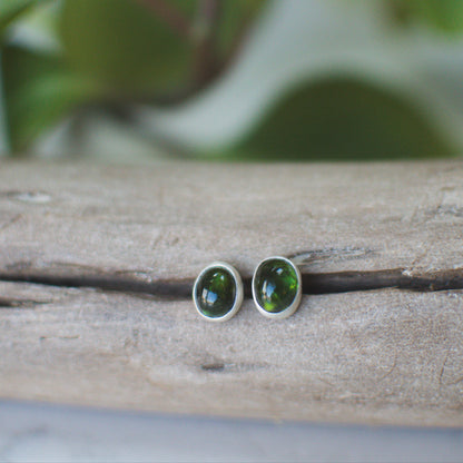 Natural tourmaline stud earrings styled on ear, colorful gemstone Natural Earth Collective Ohio