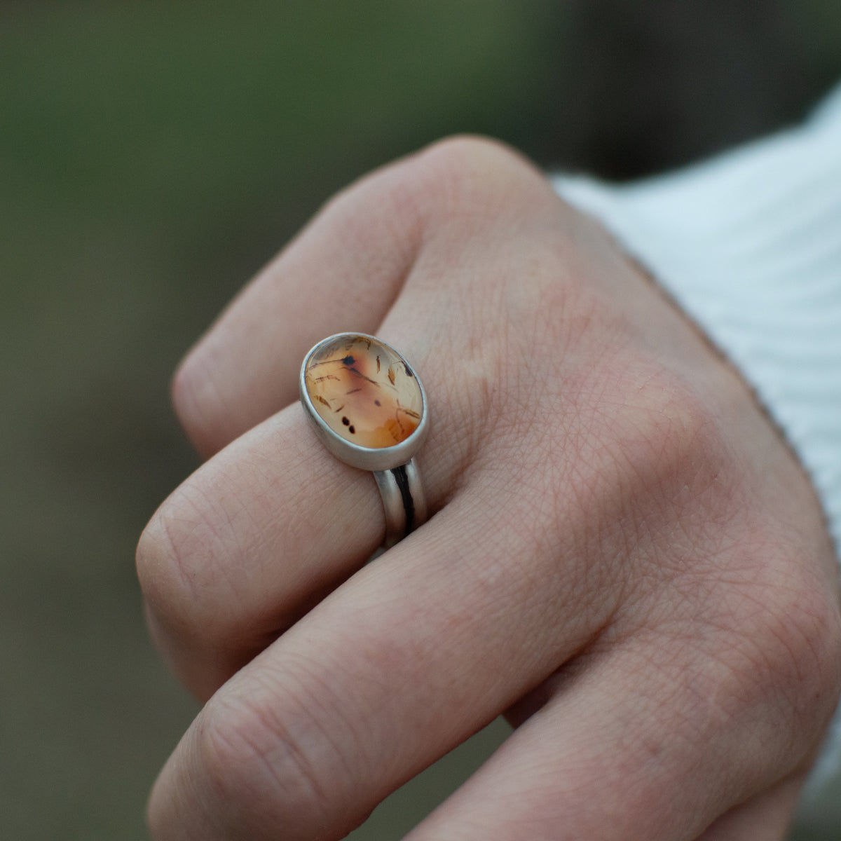 Montana Agate ring close up, warm glowing orange natural stone Natural Earth Collective Ohio