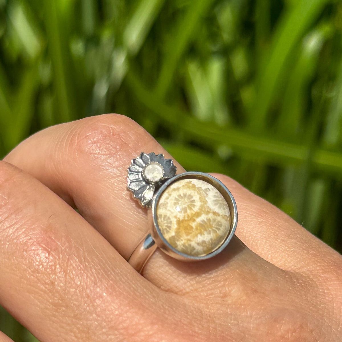 Fossilized coral moonstone ring close up, starburst coral pattern moonstone accent Natural Earth Collective Ohio