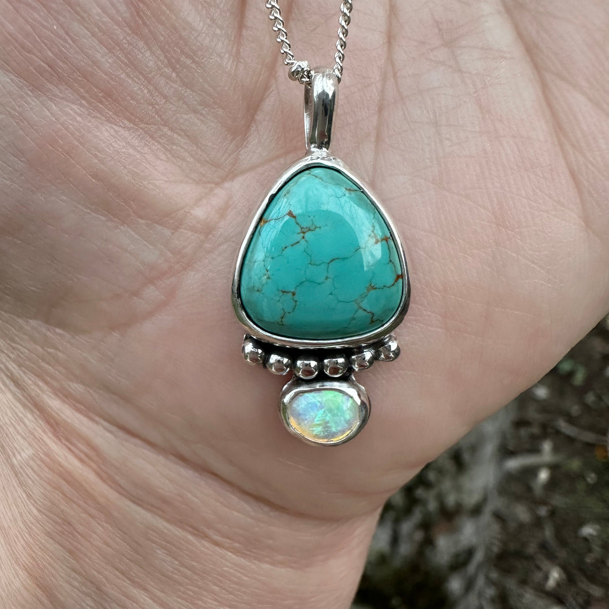 Royston Turquoise opal teardrop pendant close up, rainbow flash opal Natural Earth Collective Ohio