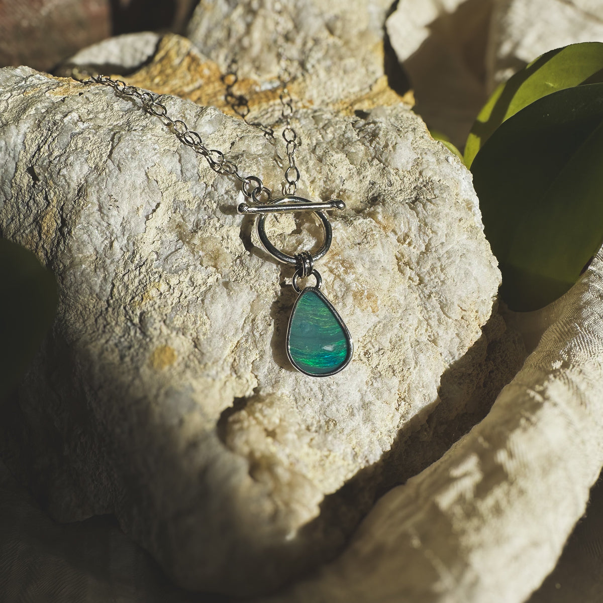 Opal teardrop toggle necklace close up, green blue color movement Natural Earth Collective Ohio