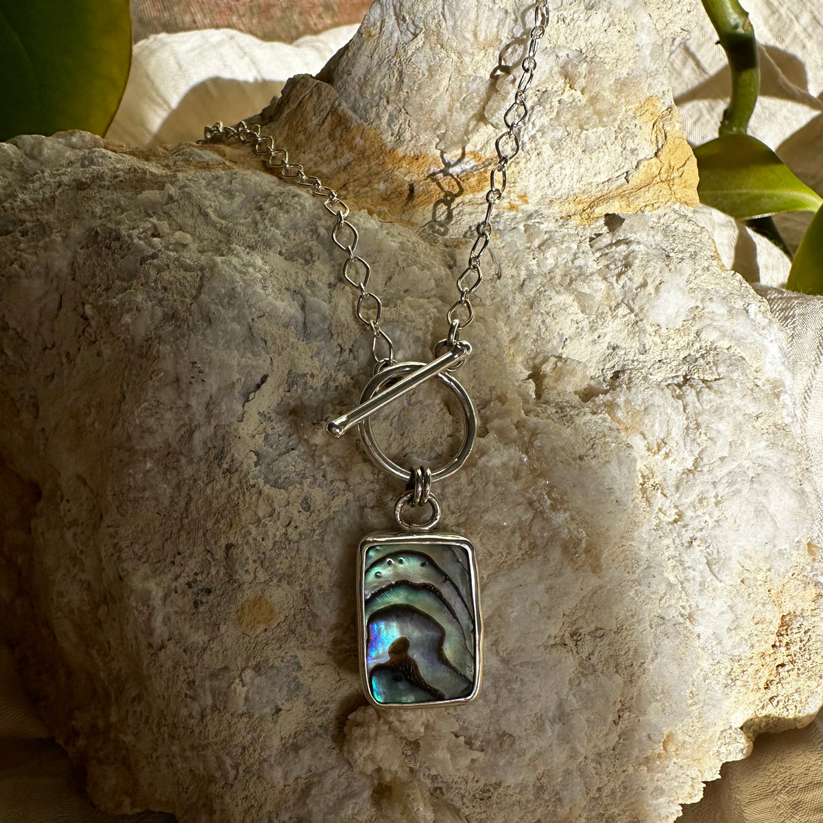 Abalone pendant necklace close up, green blue purple iridescent shell Natural Earth Collective Ohio