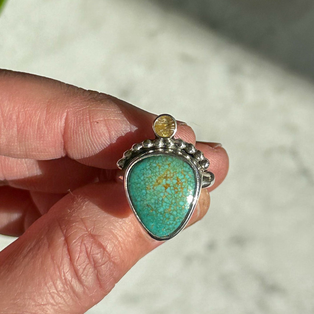 Turquoise and golden rutile quartz ring close up, natural stone fine silver Natural Earth Collective Ohio
