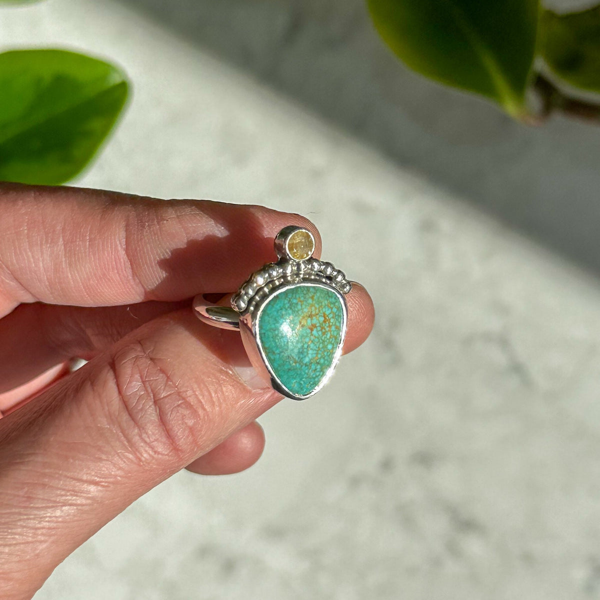 Turquoise and rutile quartz ring on hand, handcrafted sterling silver Natural Earth Collective Ohio