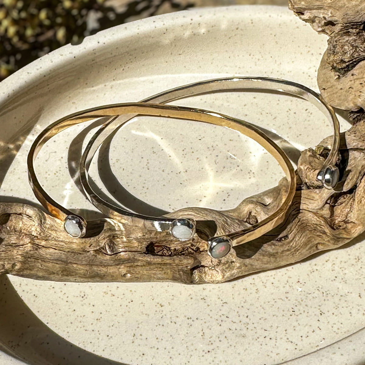 Dainty natural stone cuff bracelets styled on wrist, artisan jewelry Natural Earth Collective Ohio
