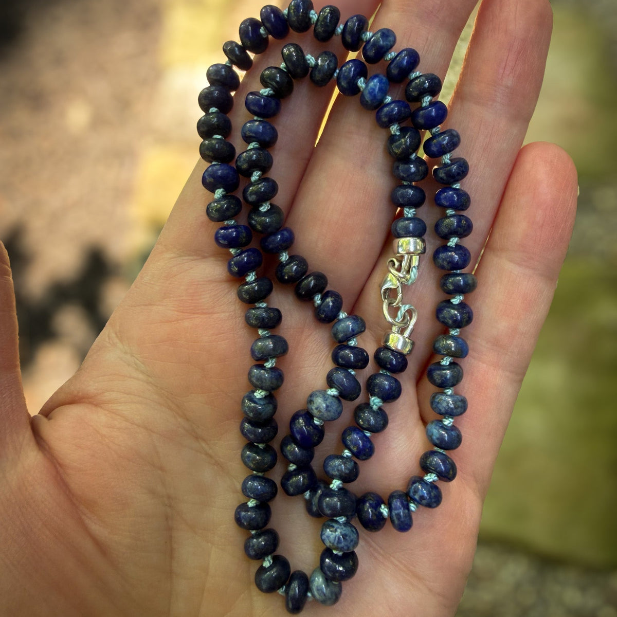 Lapis Azul rondelle beaded necklace hand knotted on pale blue sild thread. Natural Earth Collective Ohio